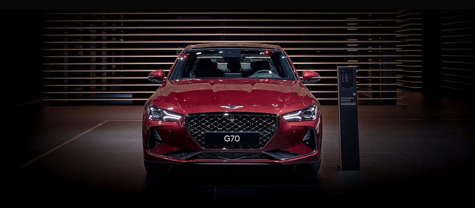 Genesis G70 red front profile in showroom 