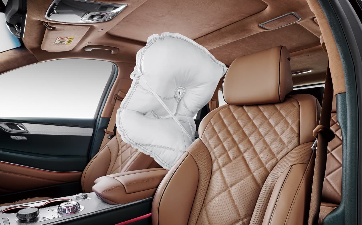 An airbag is seen between the driver's seat and the passenger seat.