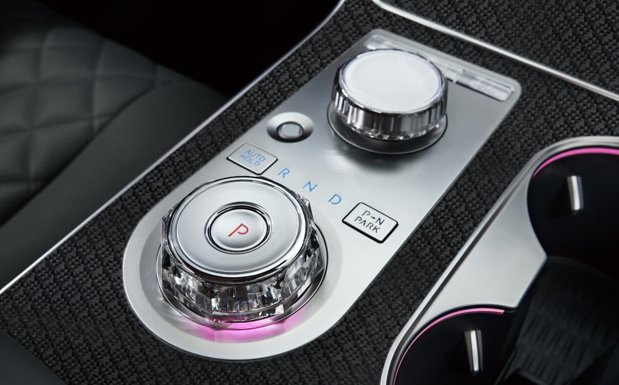 The Genesis integrated controller in the center console.