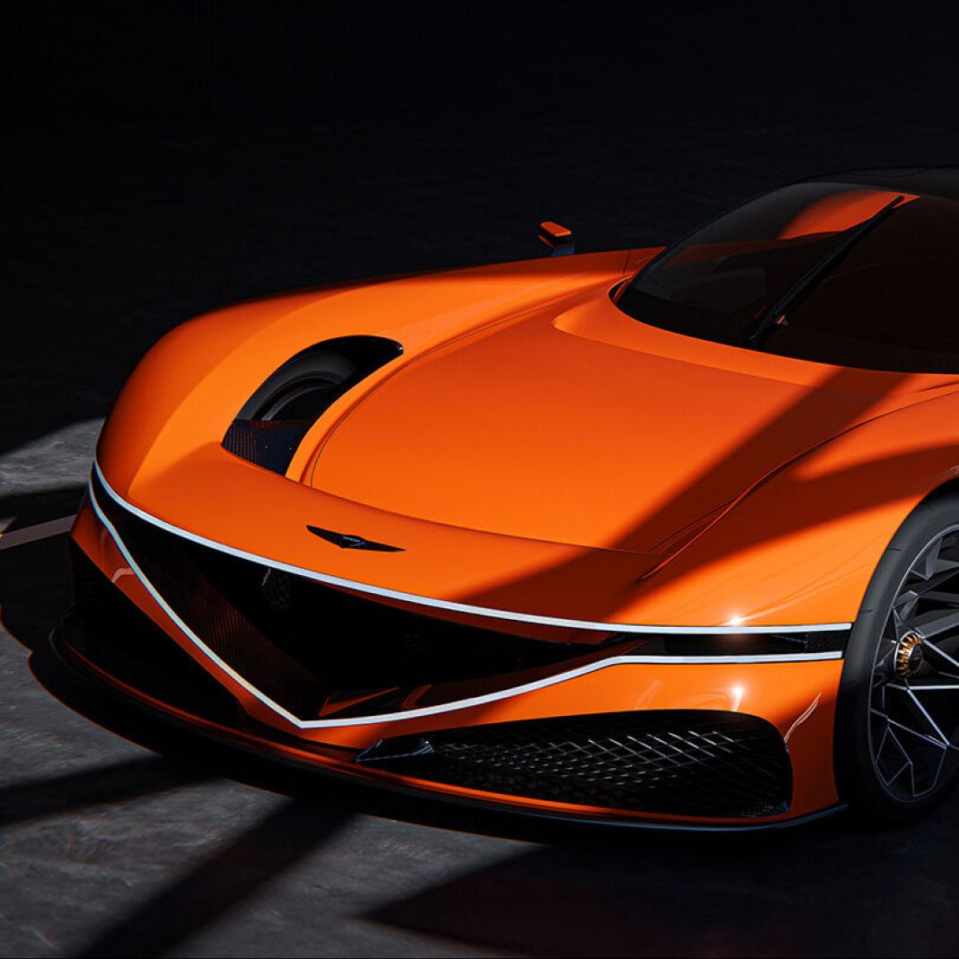 Bathed in natural light from outside, the X Gran Berlinetta Concept stands still in an indoor space. Viewed from the upper right, its front end captures attention with twin lamps embracing a V-shaped air intake, showcasing its bold design.