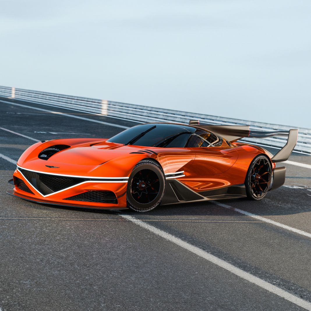 On a clear day at the circuit, the X Gran Racer Concept stands with its side profile on display. Its vivid and striking orange body gleams, reflecting the track lines. The rear wing rises high above the body, giving the car a sleek and aggressive look.