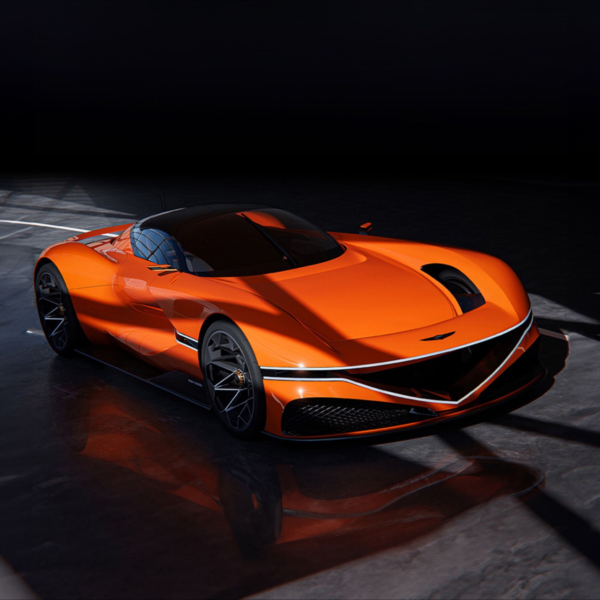 This is the front left view of the X Gran Berlinetta Concept, stationary indoors. The front lamps are illuminated, and the body reflects natural light from above, making it shine. The car's natural curves are emphasized.