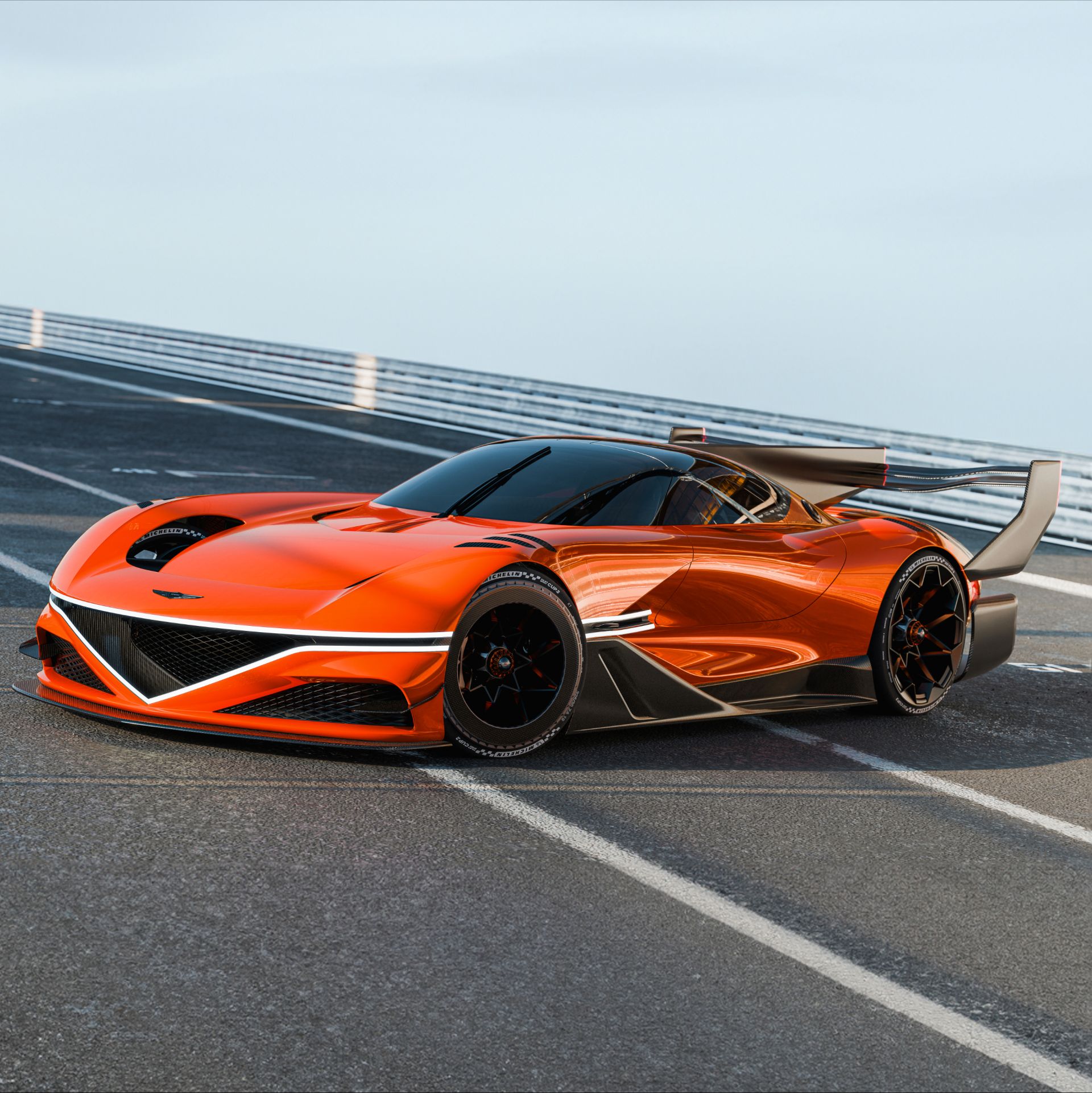 This is the front right view of the X Gran Racer Concept, stationary indoors. The front lamps are illuminated, and the body reflects its surroundings, including the floor texture, along its curves.