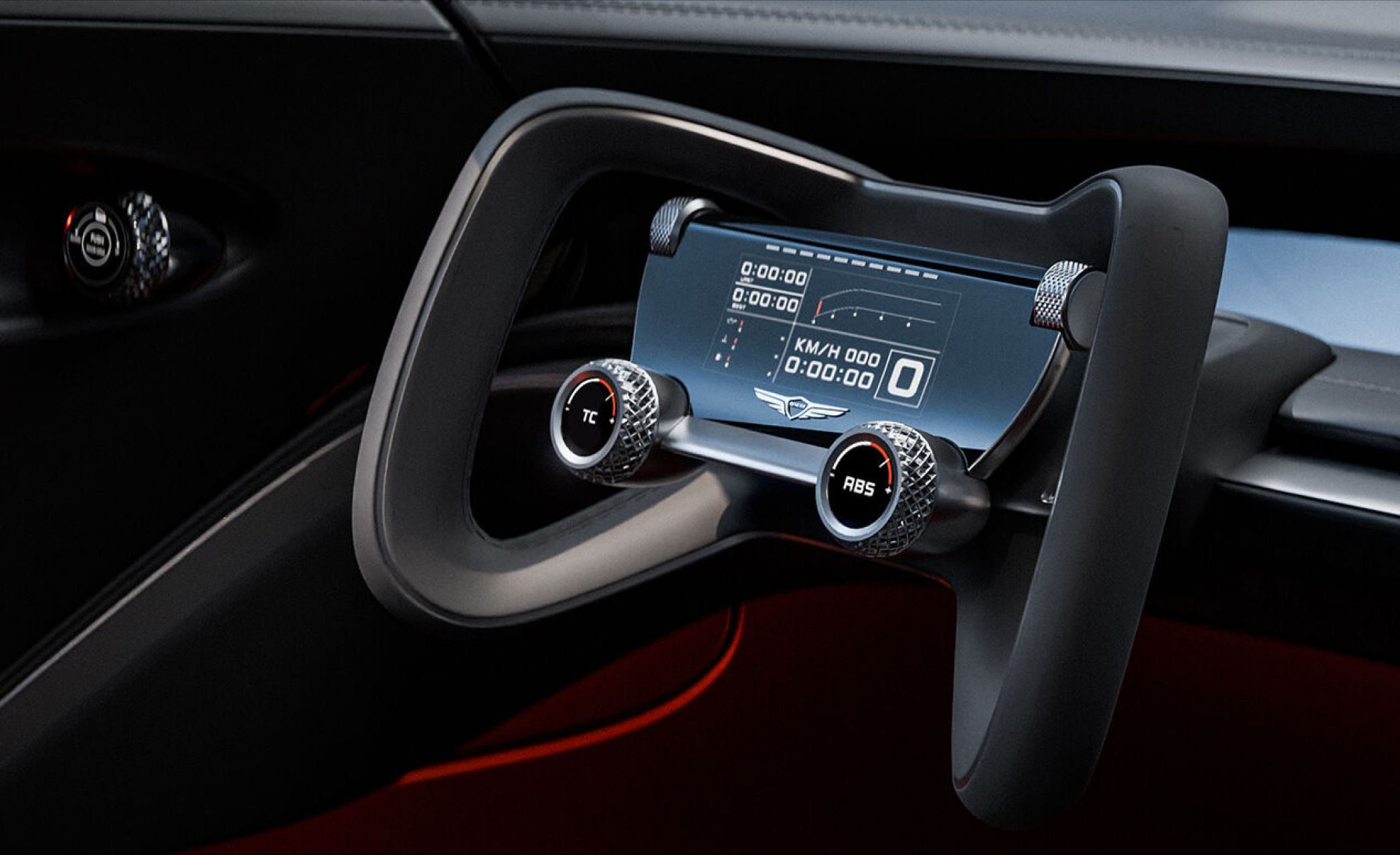 A close-up view of the X Gran Berlinetta Concept’s steering wheel reveals a central monitor flanked by ergonomic grips, offering precision at your fingertips.
