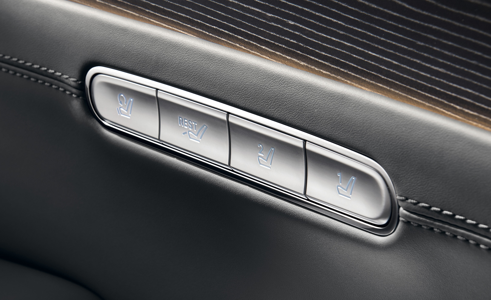 The switch with four infographic buttons is seen next to Modern Gray seats.