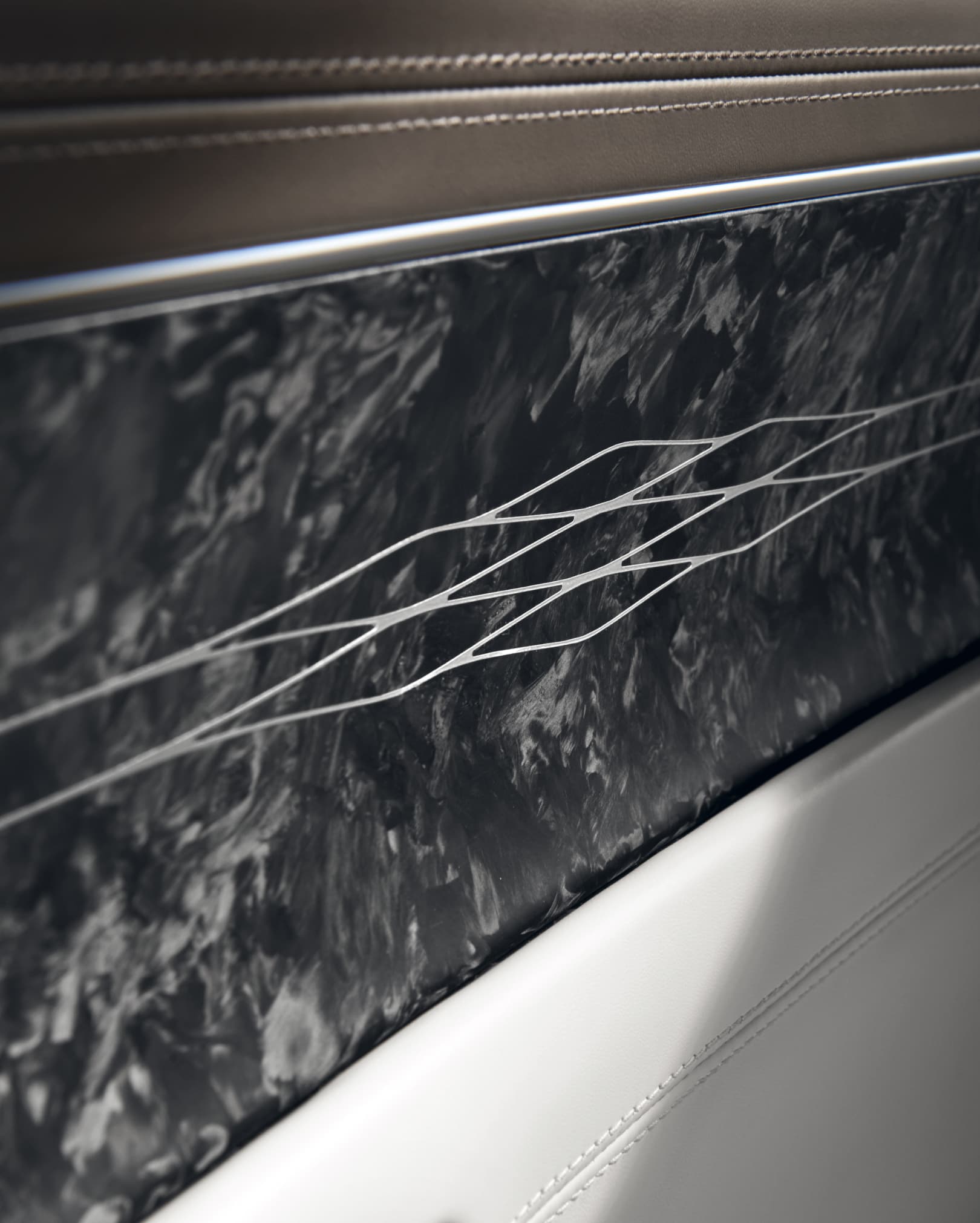 Forged Carbon Metal G-Matrix Pattern on door trim inside Urban Brown/Glacier White Two-tone interior.