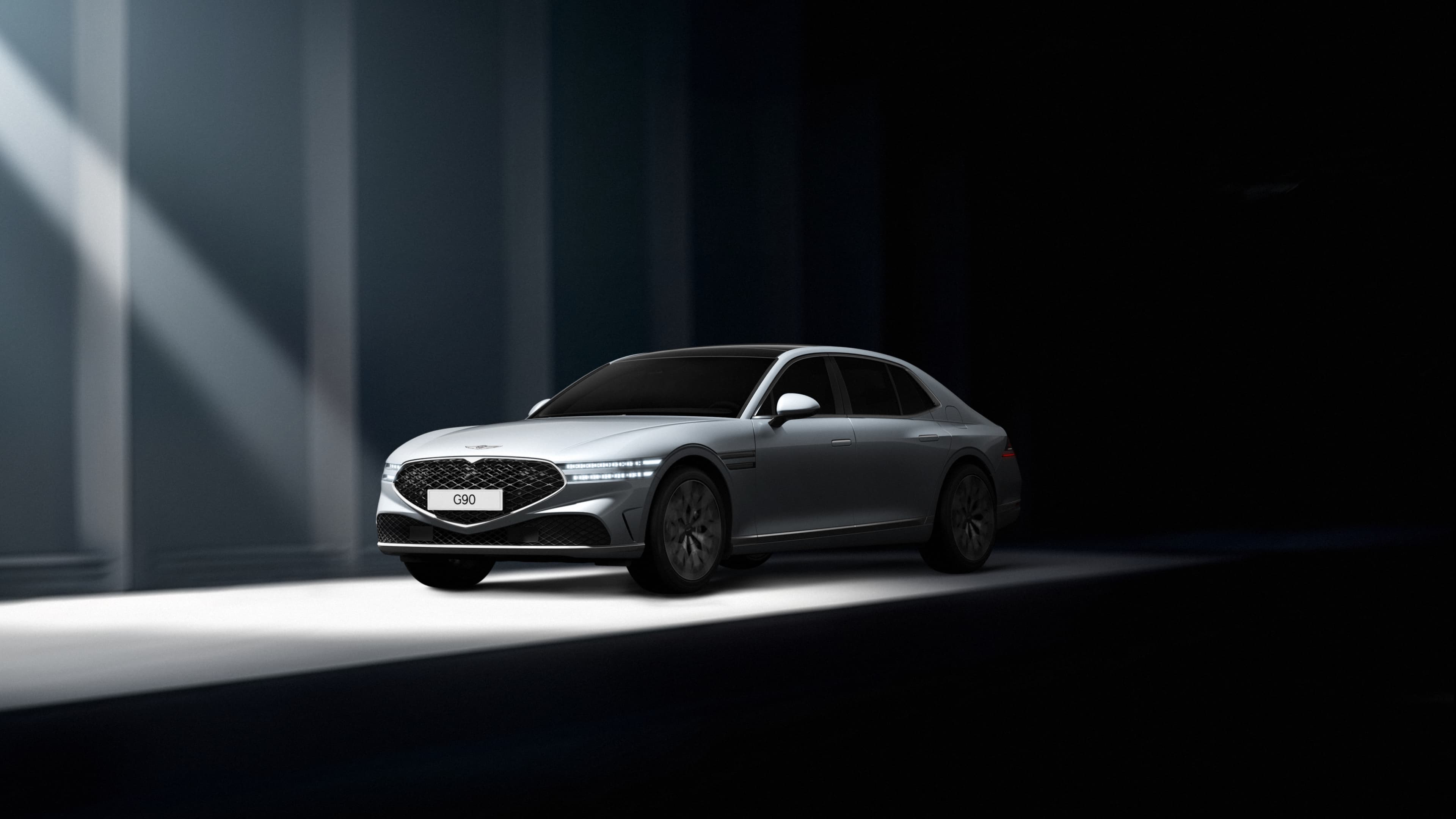 Savile Silver G90 is parked in a dark area. Light is coming from the front of the vehicle.
