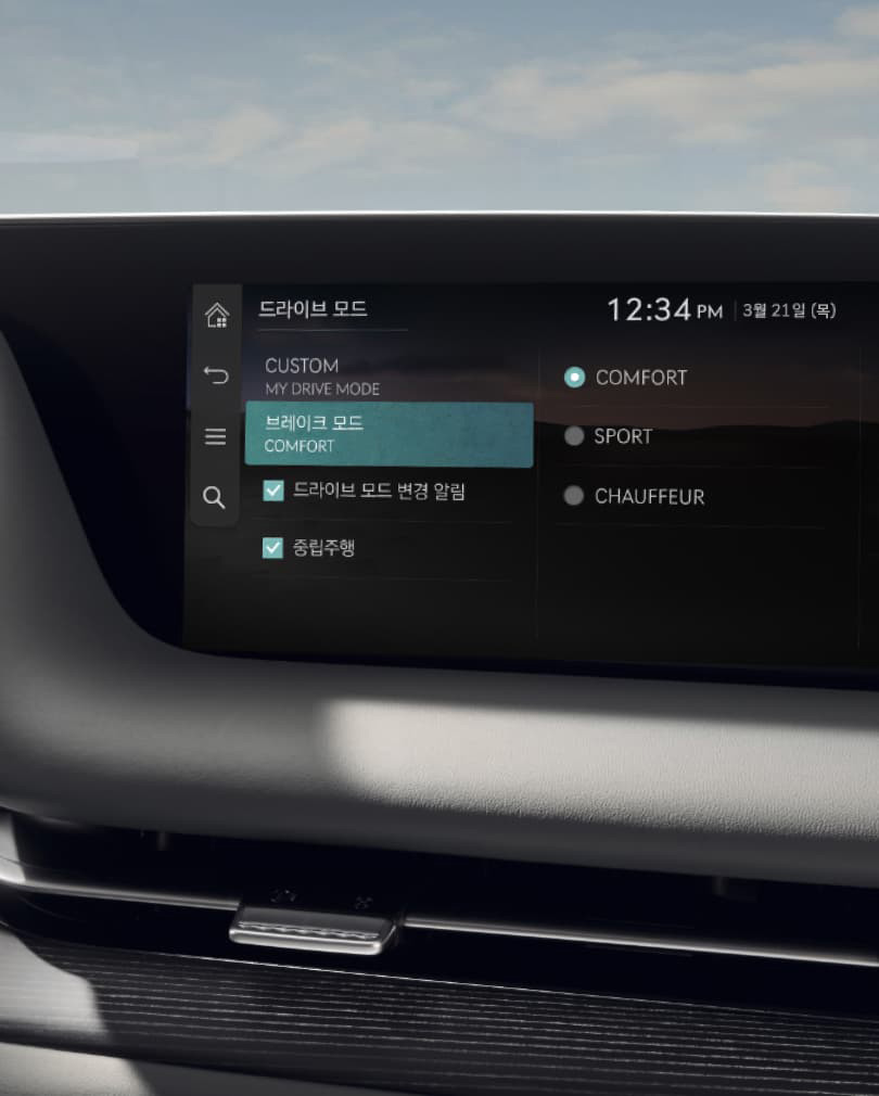 The drive mode screen is visible on the infotainment display in a Glacier White interior.