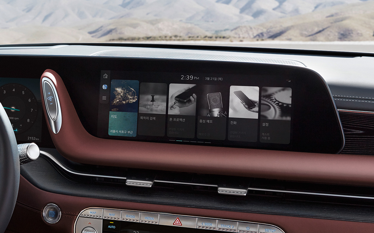 The infotainment display is seen with Bordeaux Brown seats. 