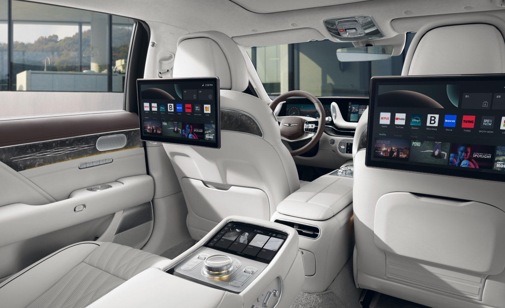 Dual Monitors installed on the back of Glacier White first-row seats.