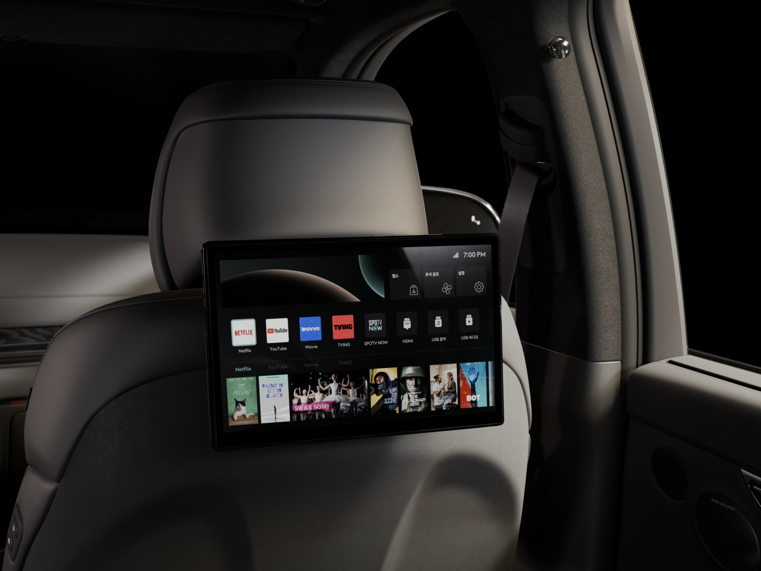 The display screen mounted behind the passenger seat headrest shows icons for streaming platforms like Netflix and YouTube.