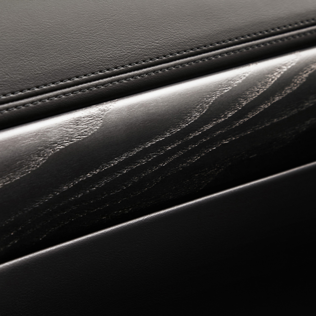 The rich texture of the black ash real wood interior trim is highlighted.