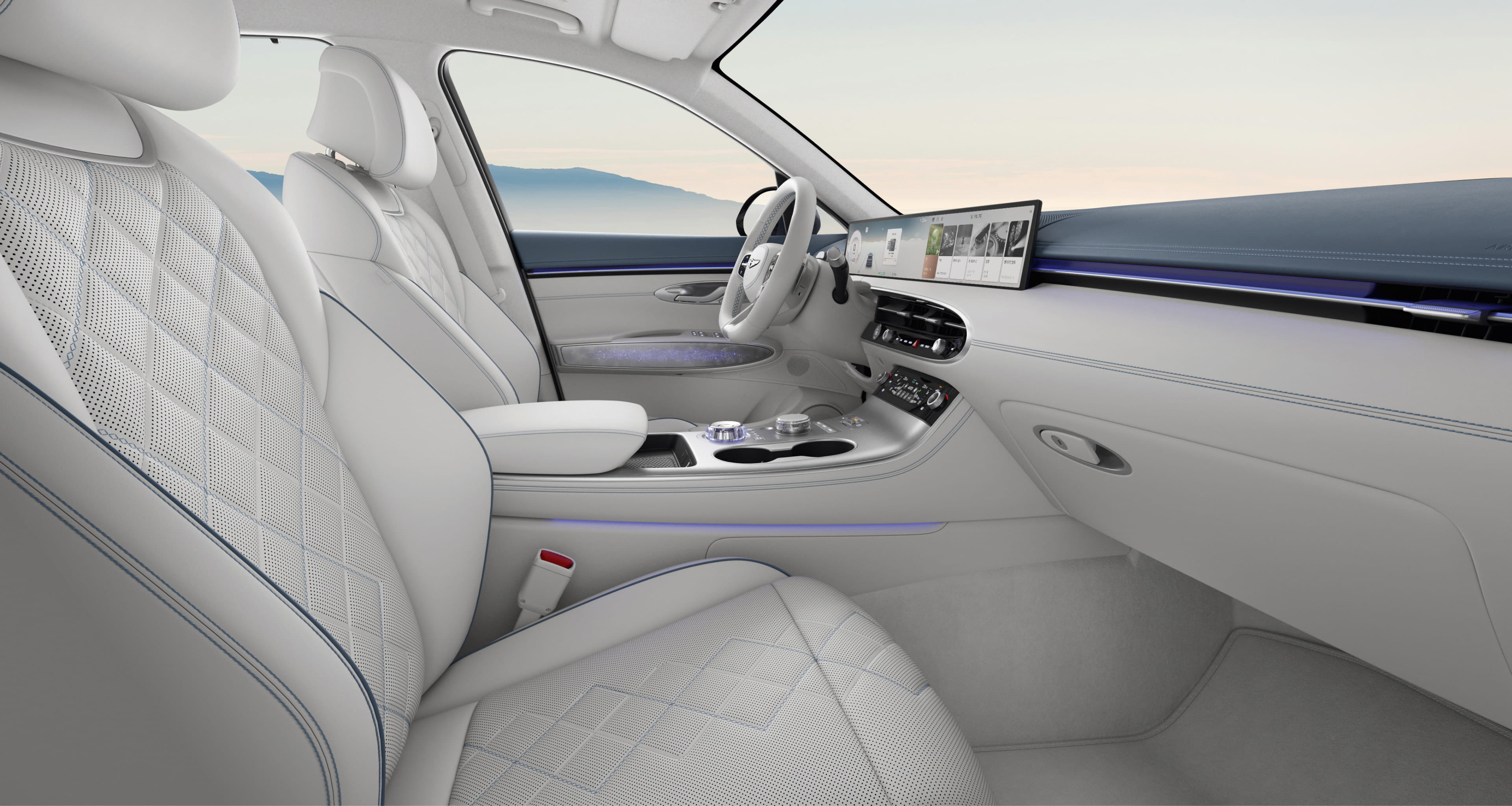 The interior of the Electrified GV70, featuring an Icy Blue/Glacier White two-tone color.