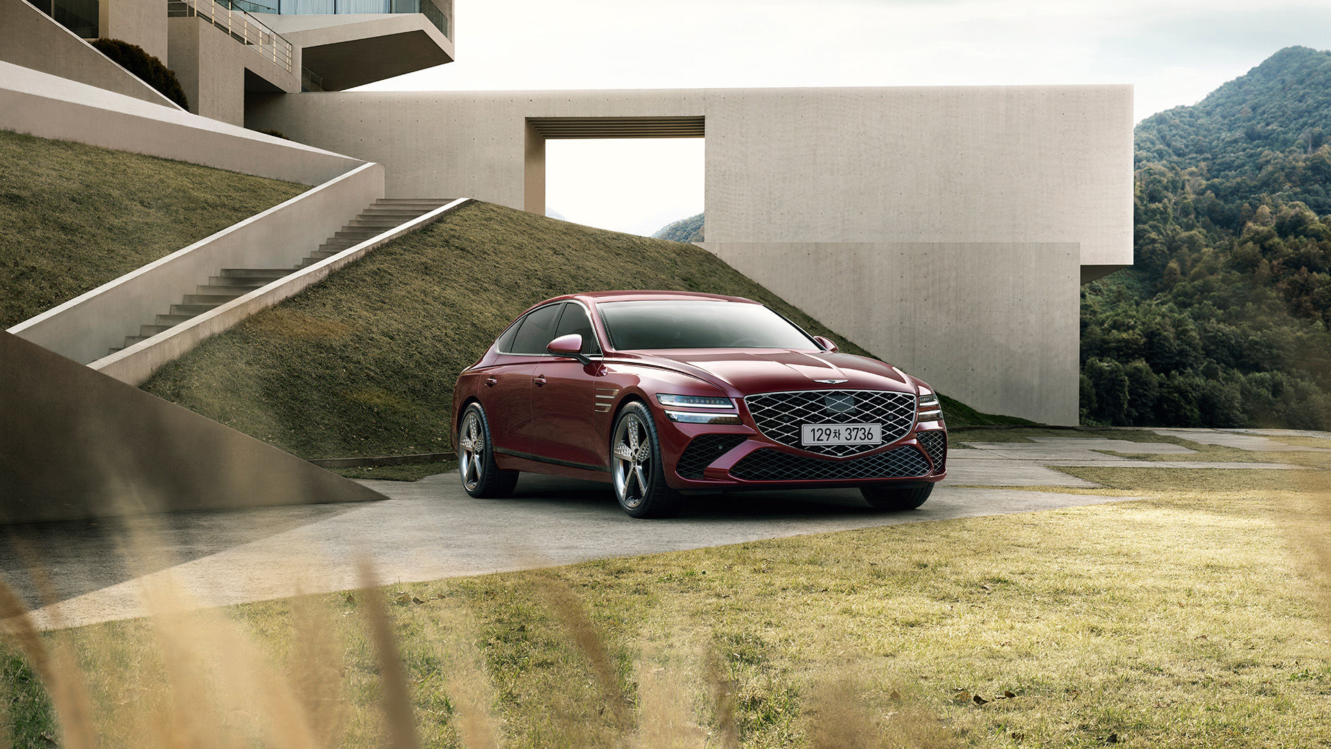 Two G80 vehicles, the Standard model and the Sport model