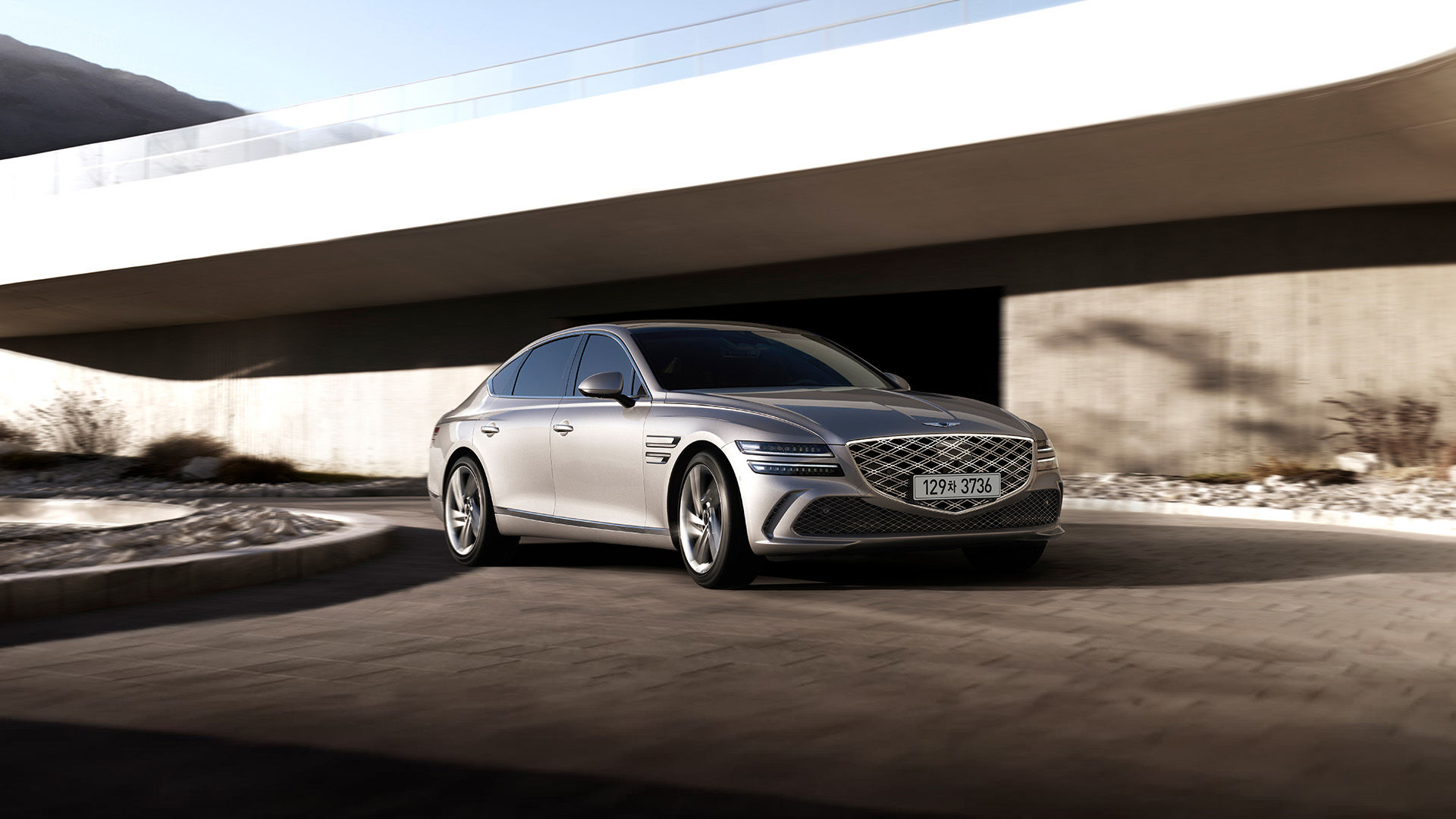 Two G80 vehicles, the Standard model and the Sport model
