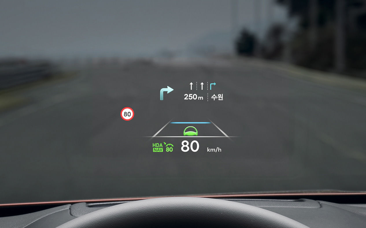 Navigation information is seen on the windshield. 