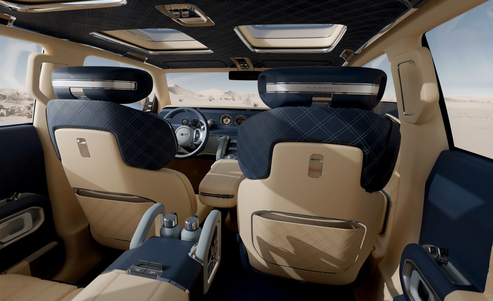 The interior design of the Genesis X Gran Equator is shown from the rear seat looking toward the front row.
