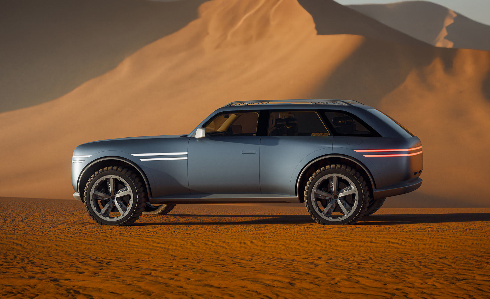The side view of the Genesis X Gran Equator concept is shown against a desert backdrop.