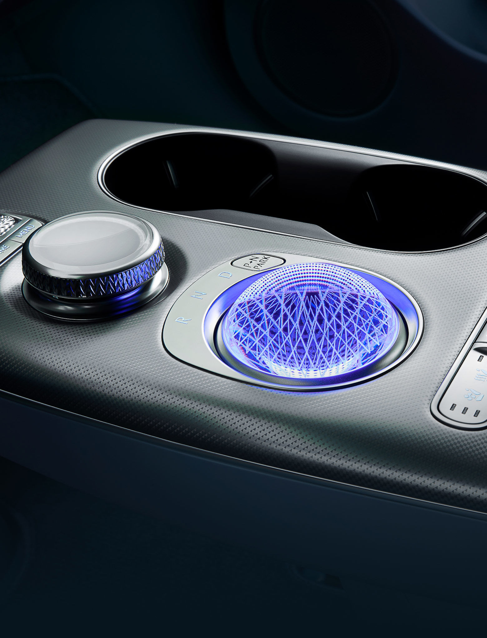 The GV60's electronic shift dial, which is subtly lit in crystal form, appears enlarged.