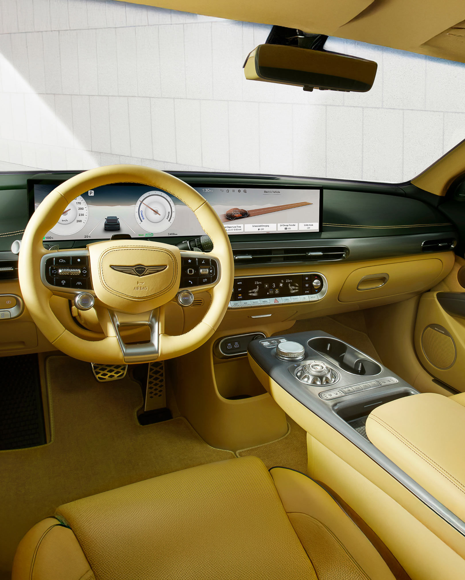 You can see the inside of the front seat of the GV60 vehicle. Various control buttons stand out.