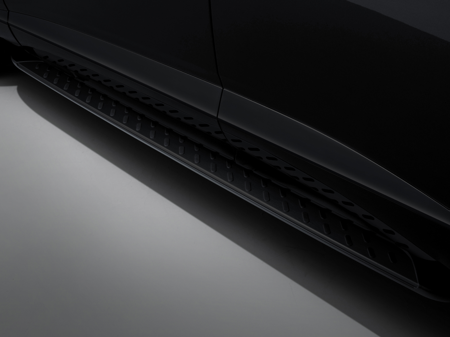 The door reveals detailed view of the slip-resistant pattern on the black colored footstep, which assists with vehicle entry.