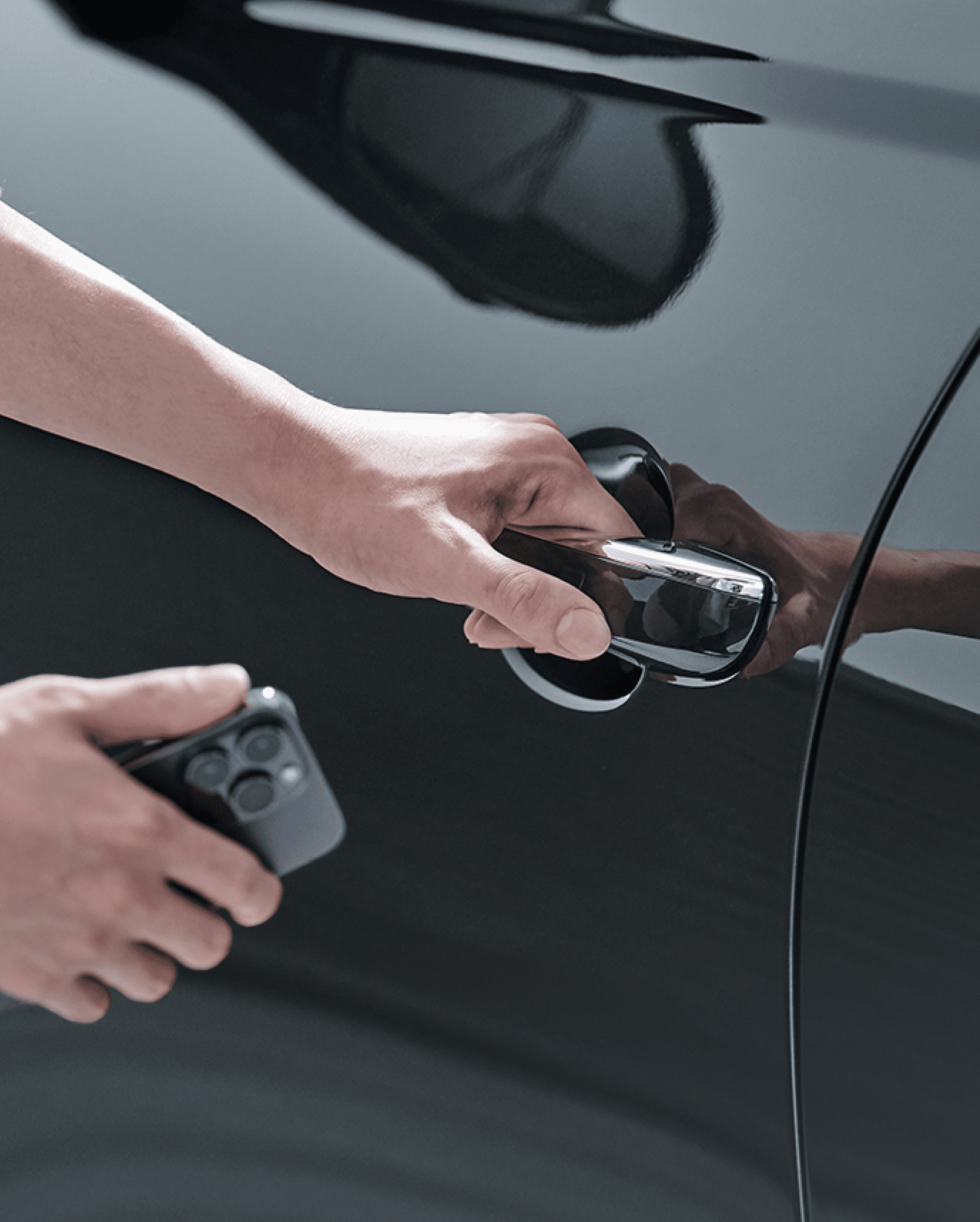 The driver is seen holding a smartphone close to the vehicle door.